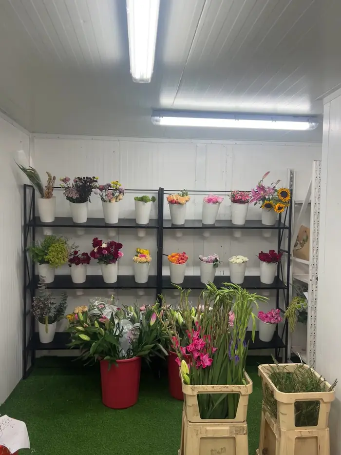 Shelves of flowers and supplies at Reemflora
