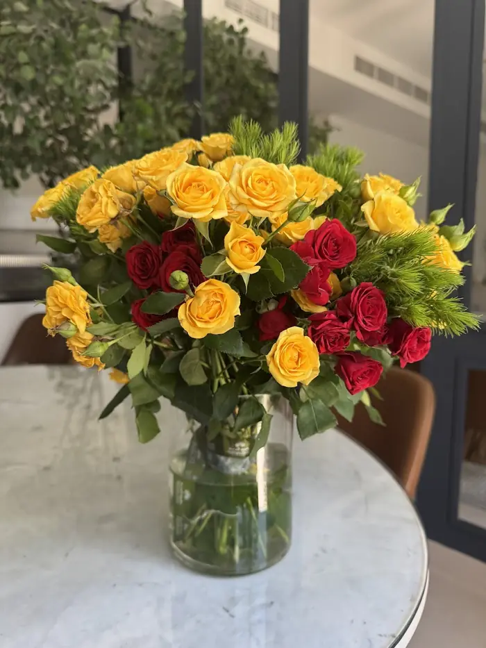 Flower arrangement in a vase at Reemflora